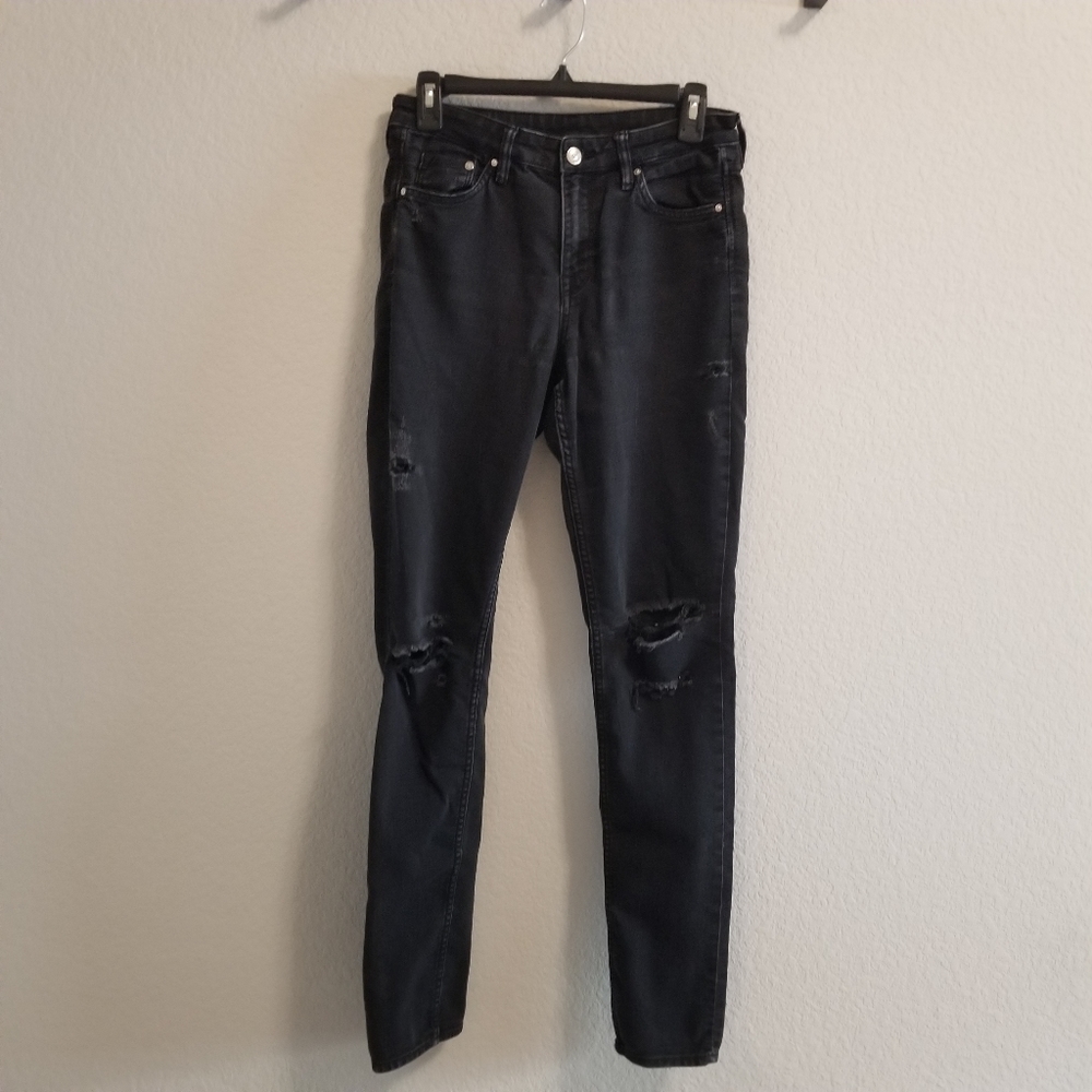 Black denim jeans with holes